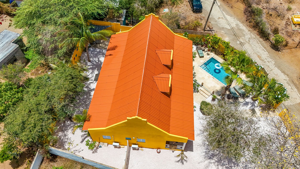 Aerial showing the full property footprint and roofline