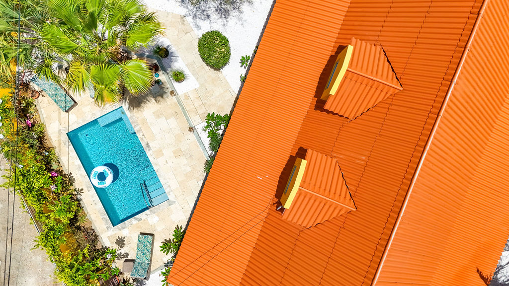 Aerial detail of the pool, deck and orange-tiled roof