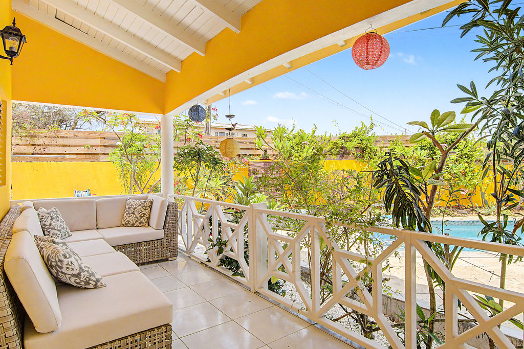 Lounge corner on the terrace with poolside view