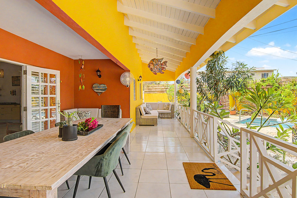 Long covered terrace with dining and lounge zones